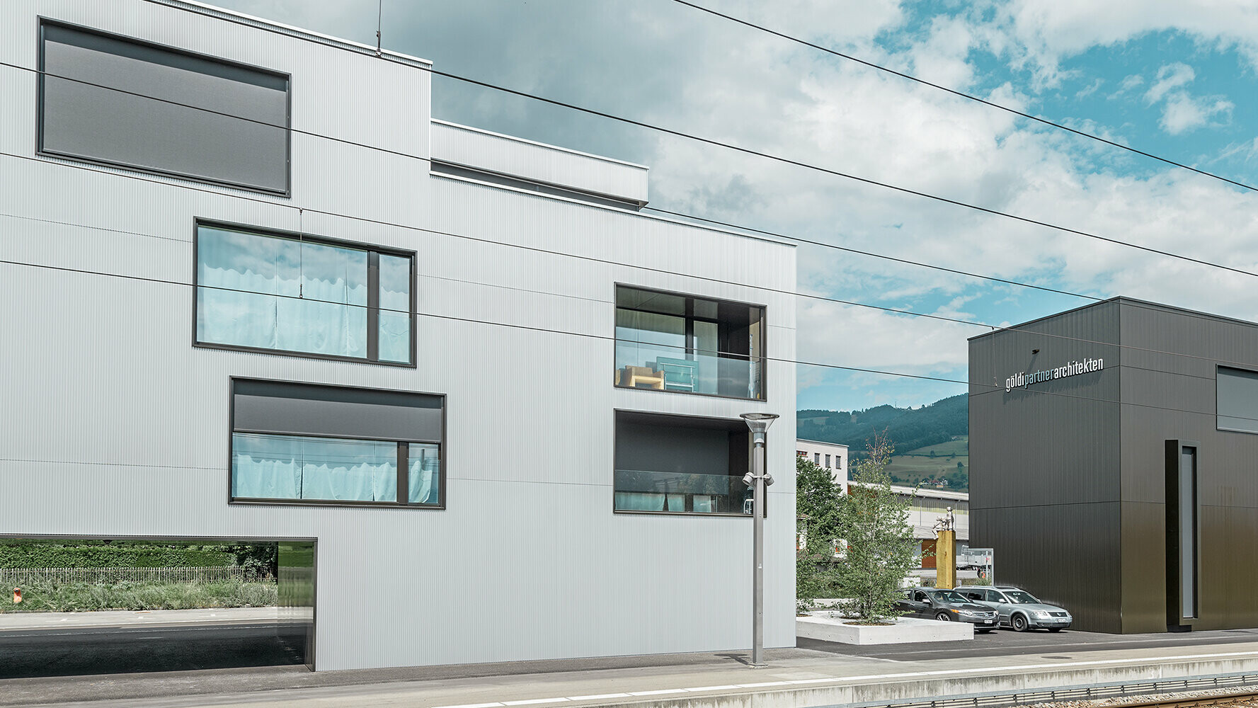 Apartment and office buildings with the PREFA serrated profile