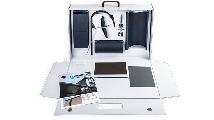 offener weißer Musterkoffer mit Mustern von PREFA Produkten;